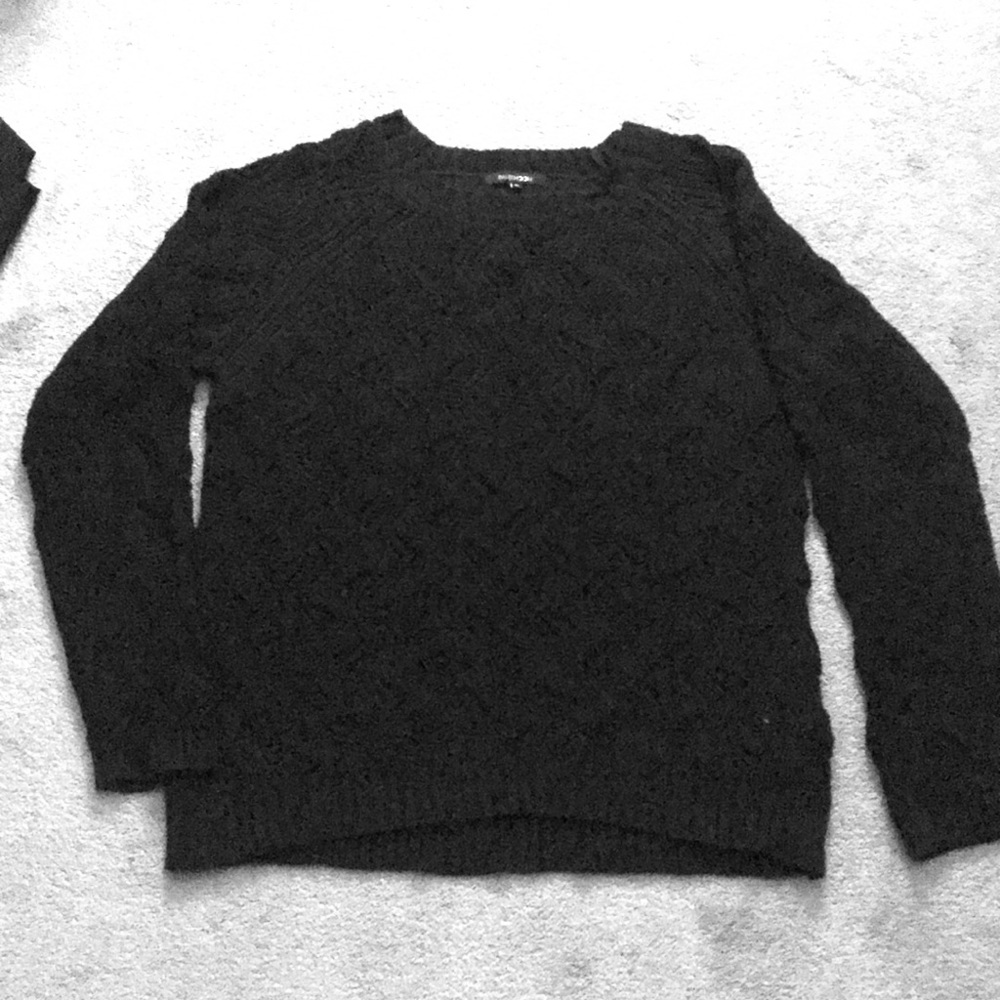 Black, casual sweater with fancy holes throughout